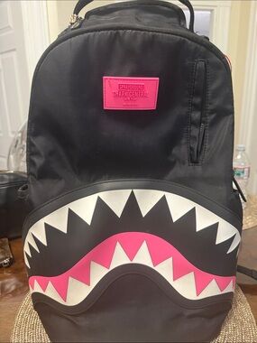 Sprayground Black Backpack with Pink & White Shark-Mouth Detail